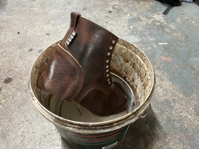 soaking-and-left-to-mellow-prior-to-lasting handmade boots process: boot soaking